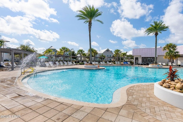 view of swimming pool with a pergola and a patio area