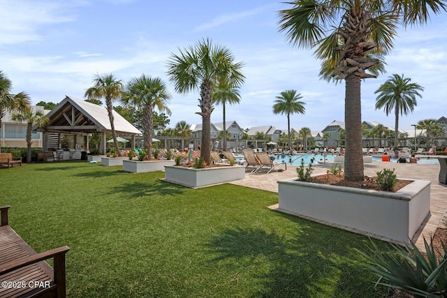 view of home's community featuring a pool, a gazebo, and a yard