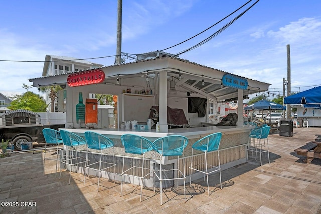 view of swimming pool with a gazebo and exterior bar