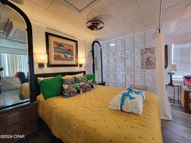 bedroom with wood finished floors