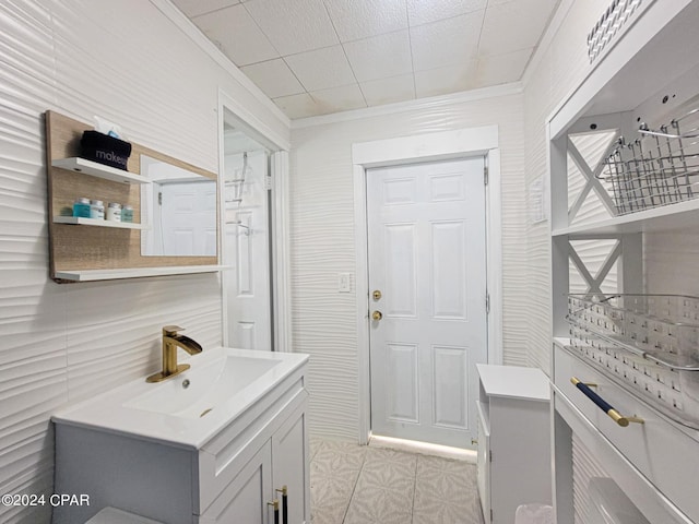 bathroom with vanity and crown molding