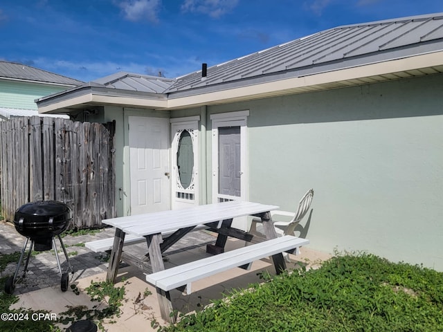 view of patio / terrace with outdoor dining area, fence, and area for grilling