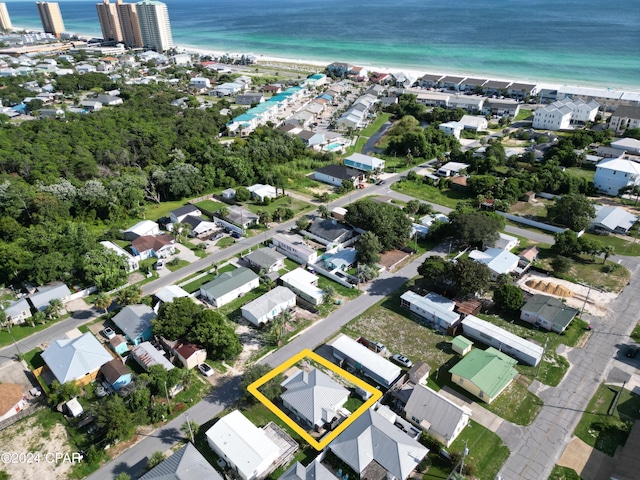 drone / aerial view with a water view and a view of the beach