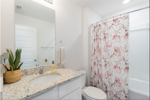 full bathroom featuring vanity, shower / tub combo, and toilet