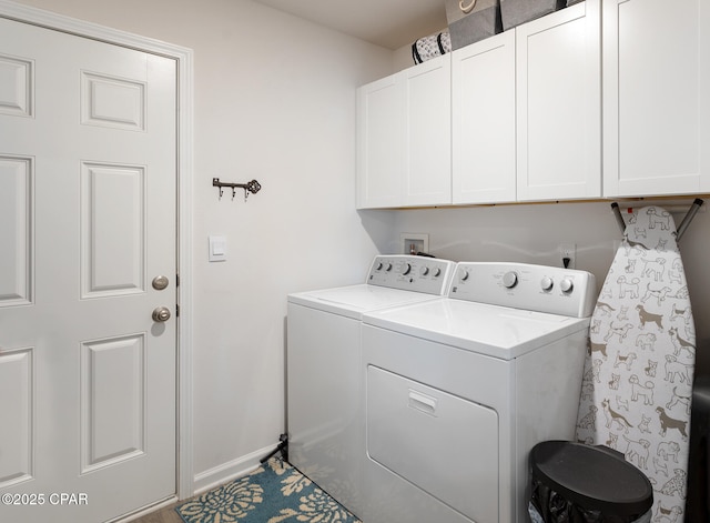 laundry area featuring cabinets and washer and dryer