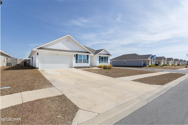 ranch-style house with a garage and central AC