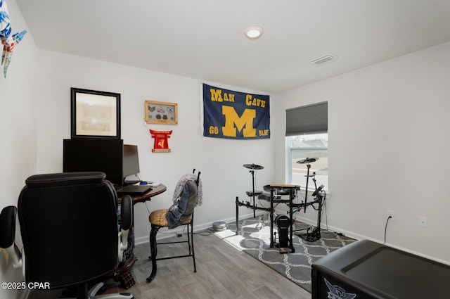 office space with light hardwood / wood-style flooring
