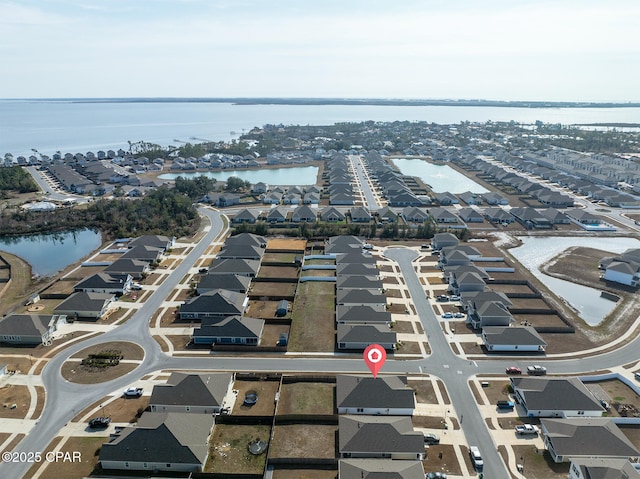 bird's eye view with a water view