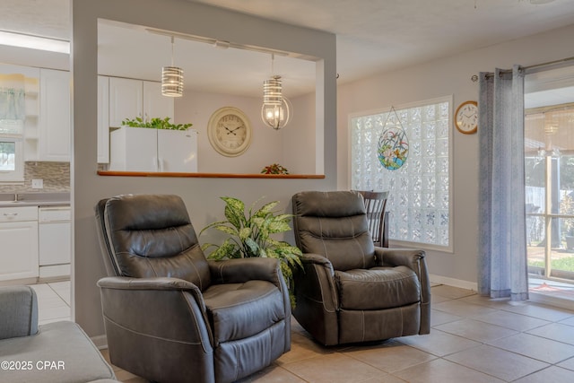 sitting room with light tile patterned floors