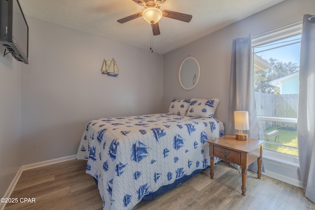 bedroom featuring hardwood / wood-style flooring and ceiling fan