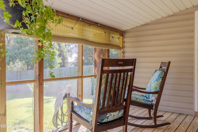 sunroom / solarium with vaulted ceiling