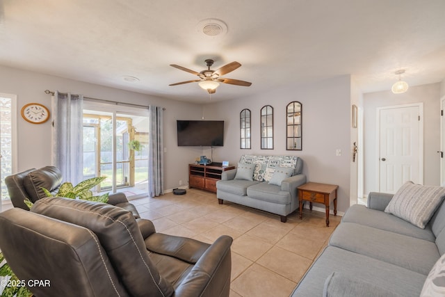 living room with light tile patterned floors and ceiling fan