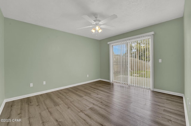 unfurnished room with a textured ceiling, ceiling fan, and light wood-type flooring