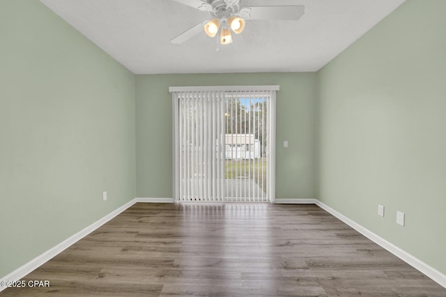 spare room featuring ceiling fan and light hardwood / wood-style flooring