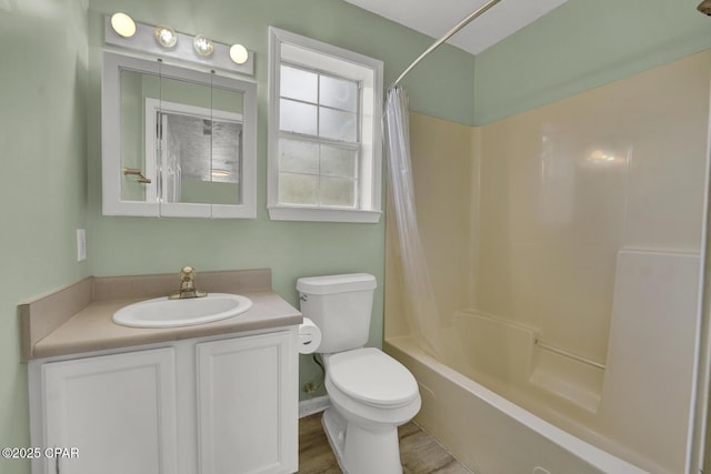 full bathroom featuring vanity, wood-type flooring, shower / bath combination with curtain, and toilet