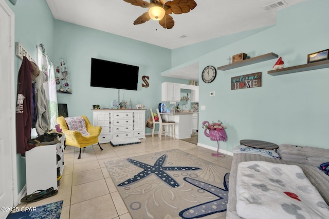 tiled living room with sink and ceiling fan