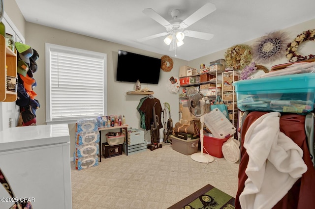 bedroom with light colored carpet and ceiling fan