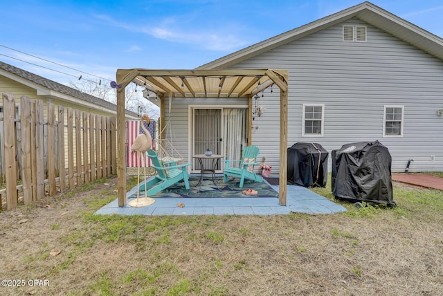 rear view of property with a lawn and a patio area