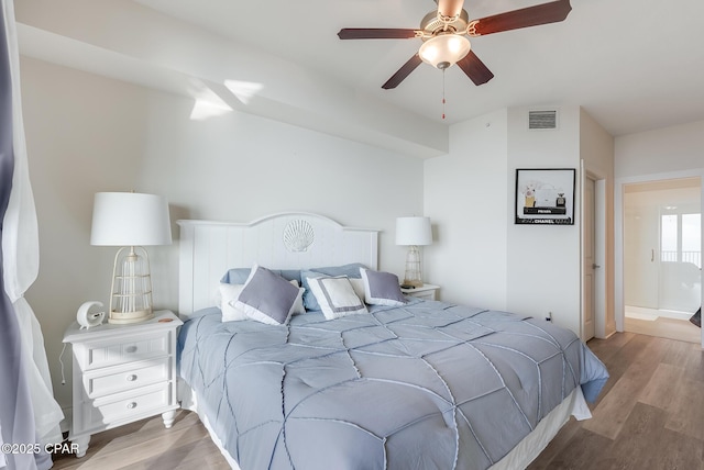 bedroom with ceiling fan and light wood-type flooring