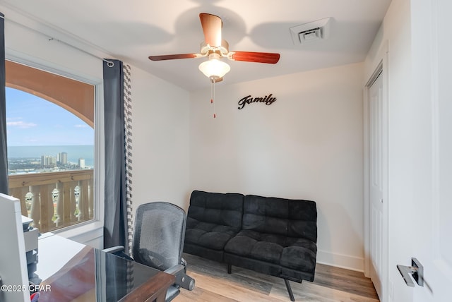 office featuring light hardwood / wood-style flooring and ceiling fan