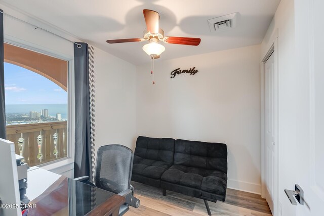 office featuring light hardwood / wood-style flooring and ceiling fan