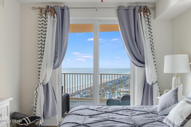 bedroom featuring a water view