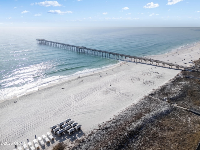 drone / aerial view with a water view and a beach view