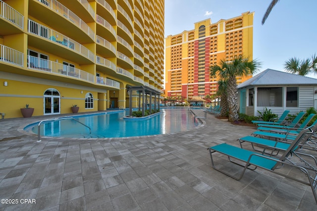 view of swimming pool with a patio area