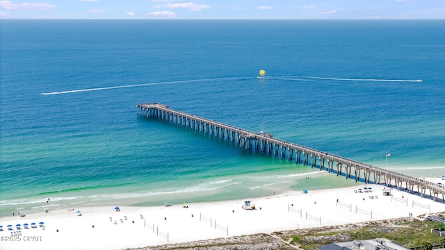 dock area featuring a view of the beach and a water view