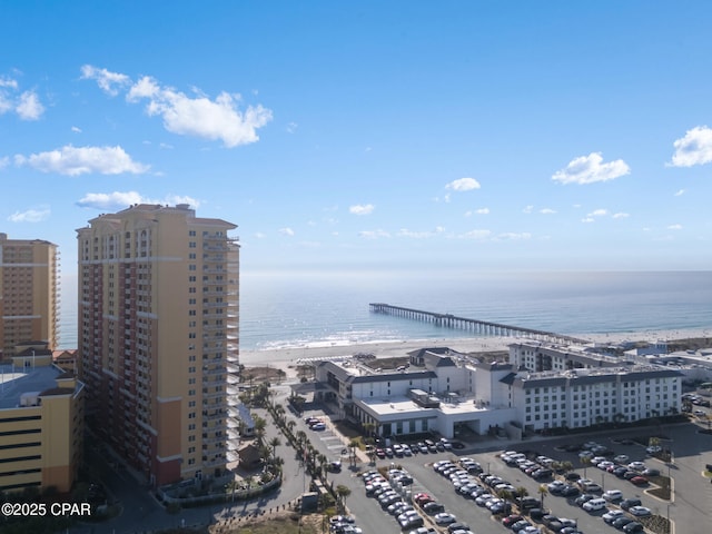 birds eye view of property featuring a water view and a view of the beach