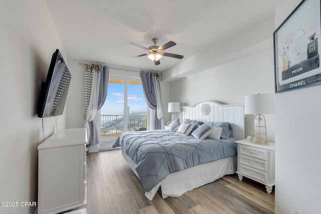 bedroom with access to exterior, ceiling fan, and light wood-type flooring