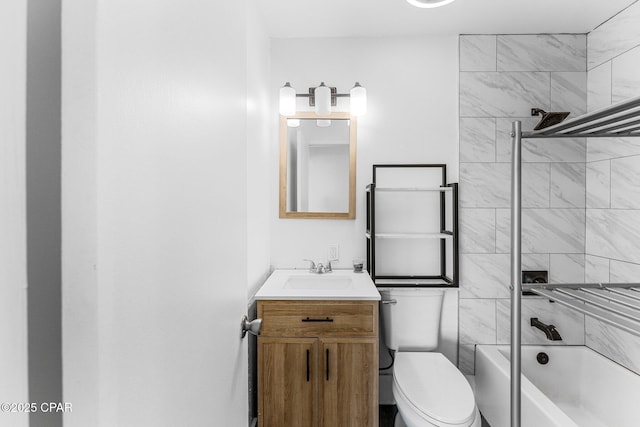 full bathroom with tiled shower / bath combo, vanity, and toilet