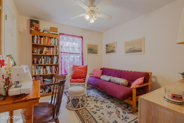 living area with ceiling fan