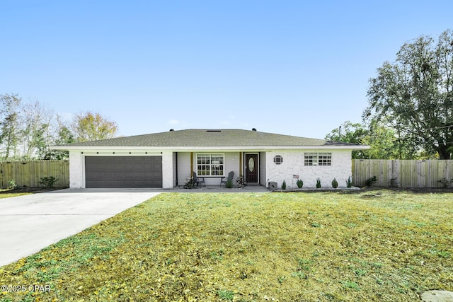 single story home with a garage and a front yard