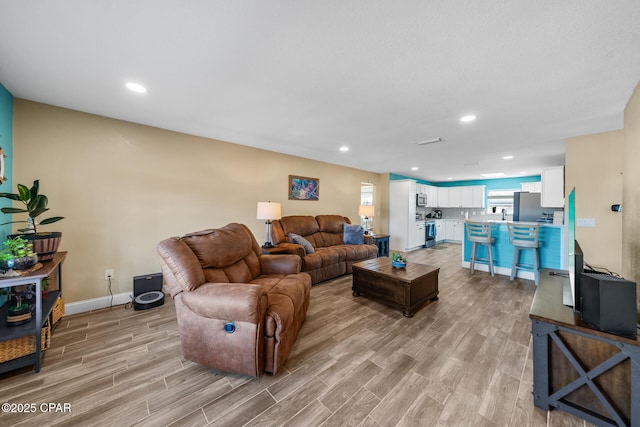 living room featuring light wood-type flooring