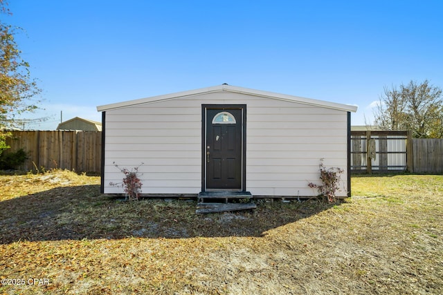 view of outdoor structure with a lawn