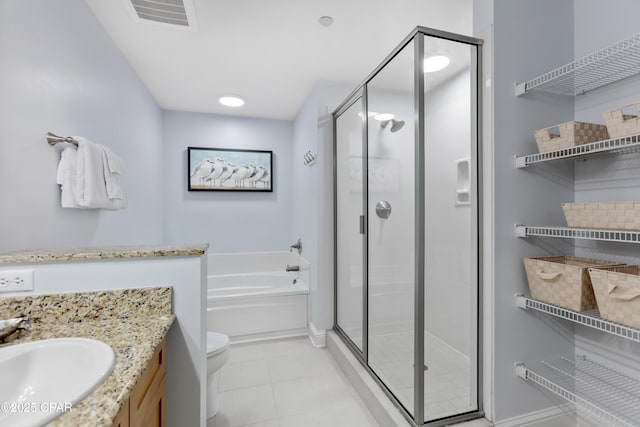 full bathroom featuring vanity, shower with separate bathtub, tile patterned floors, and toilet