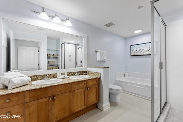 full bathroom featuring tile patterned floors, toilet, independent shower and bath, and vanity