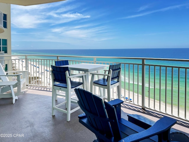 balcony with a beach view and a water view