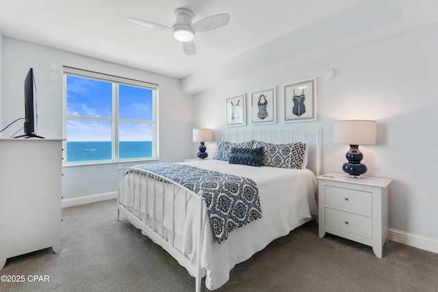 bedroom featuring ceiling fan and dark colored carpet