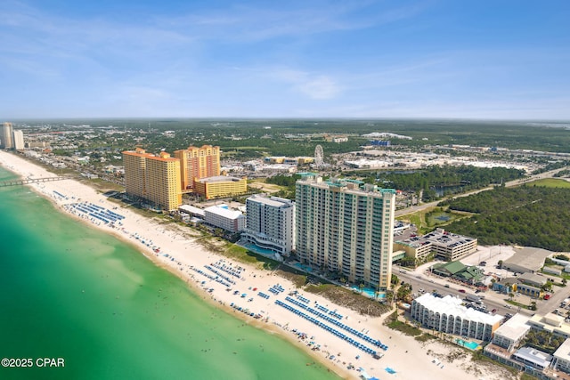 bird's eye view with a water view and a beach view