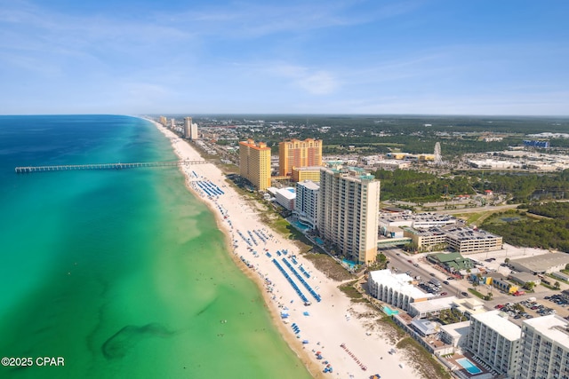 birds eye view of property featuring a water view and a view of the beach