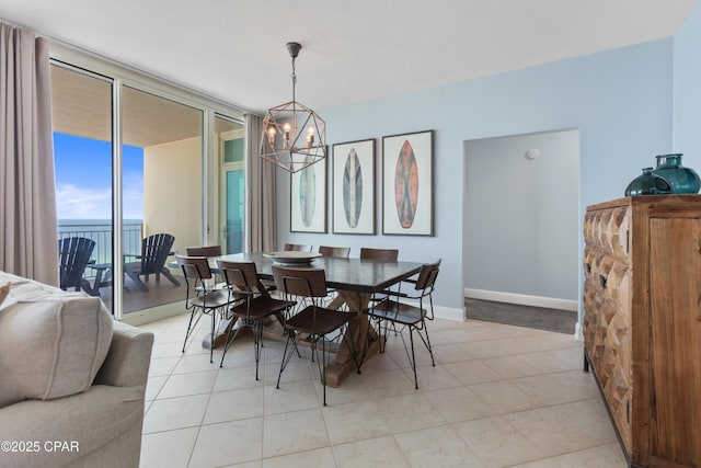 dining area featuring a water view, floor to ceiling windows, light tile patterned floors, and a notable chandelier