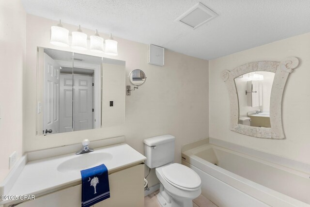 4600 Kingfish Ln Unit 508, Panama City, FL 32408 - full bath with toilet, a textured ceiling, and vanity