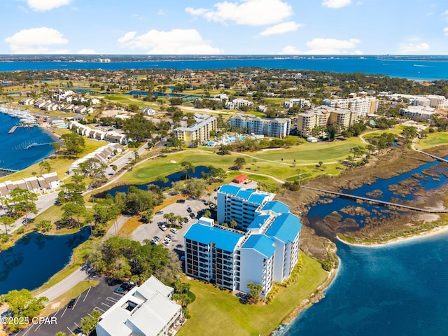 birds eye view of property with a water view, a view of city, and golf course view