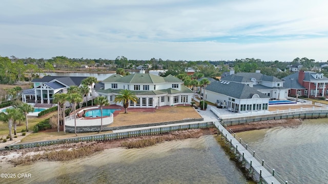 birds eye view of property featuring a water view