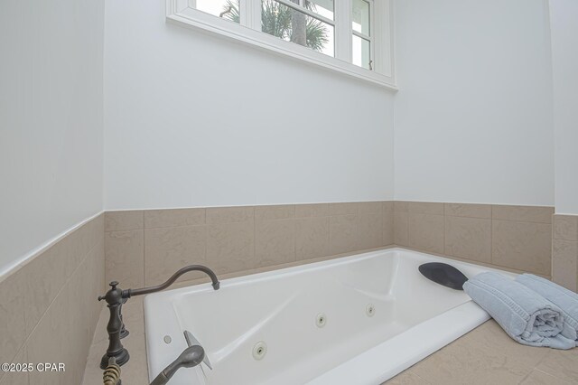 bathroom with tiled bath