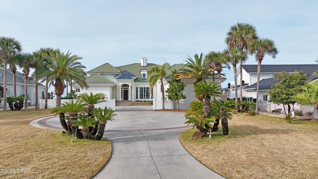 view of front of home with a garage and a front yard