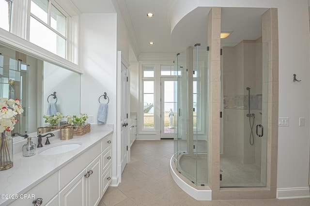 bathroom featuring crown molding, tile patterned floors, vanity, and an enclosed shower