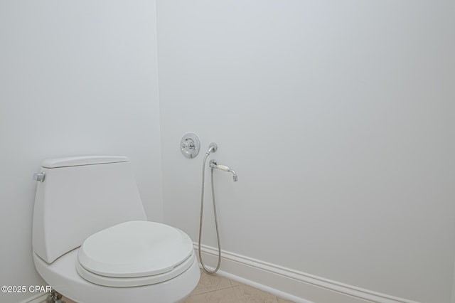 bathroom featuring tile patterned flooring and toilet